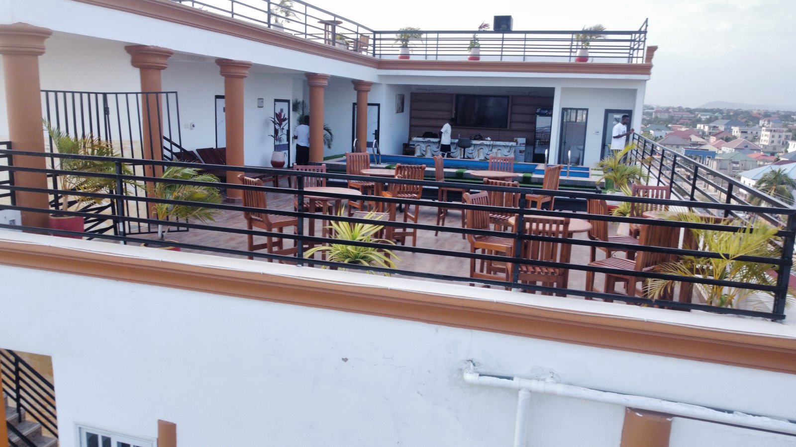 Rooftop bar seating at Classic Hideout Apartment